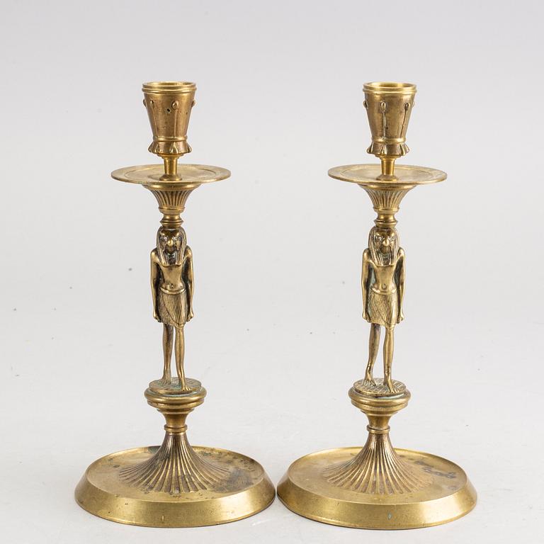 A pair of early 20th century brass candle sticks.