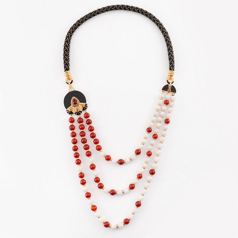 Lalique, necklace, "L'Oiseau de Feu", 18K gold with fire opal, sapphires, and diamonds on black jade.