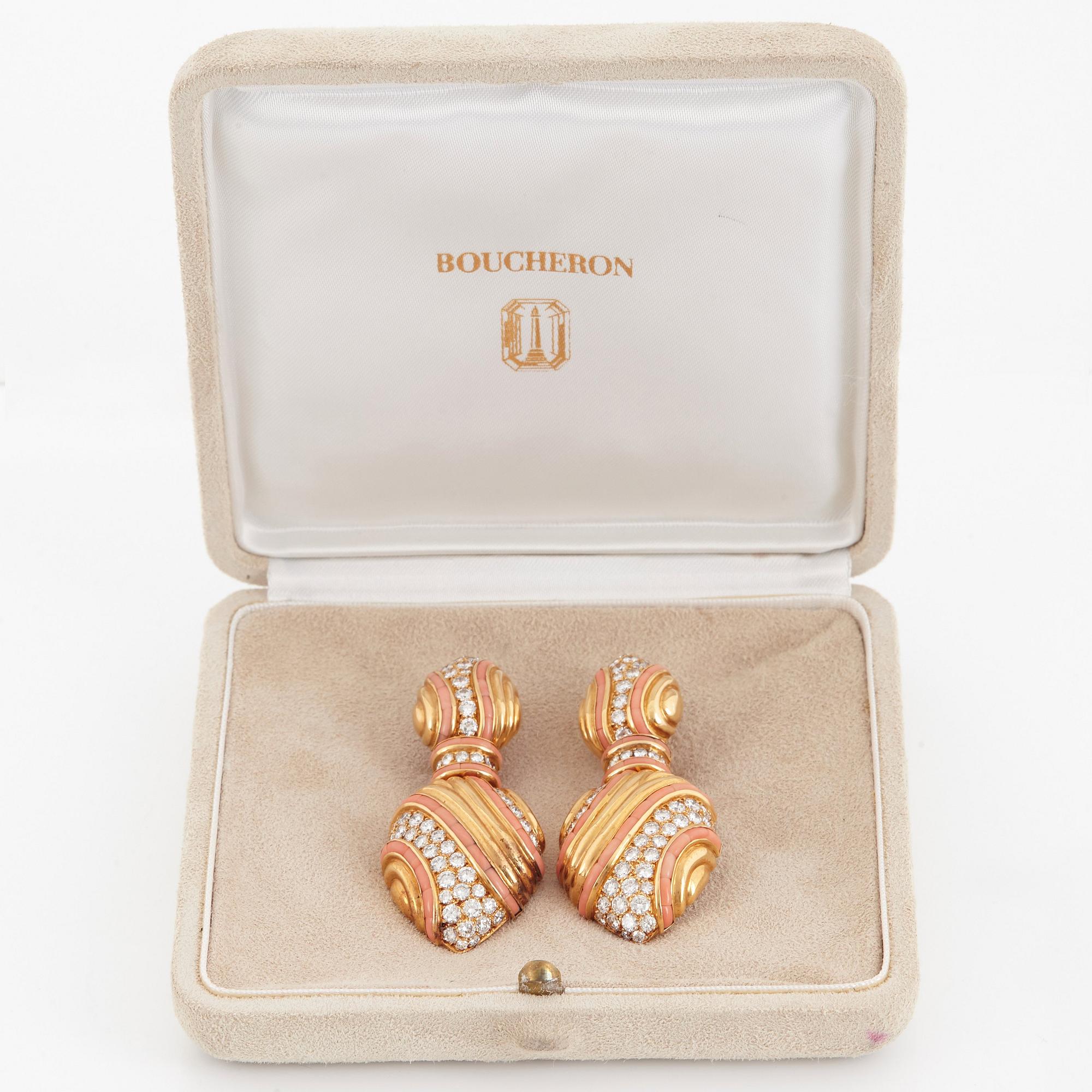 A pair of 18K gold Boucheron earrings set with round brilliant-cut diamonds and coral.