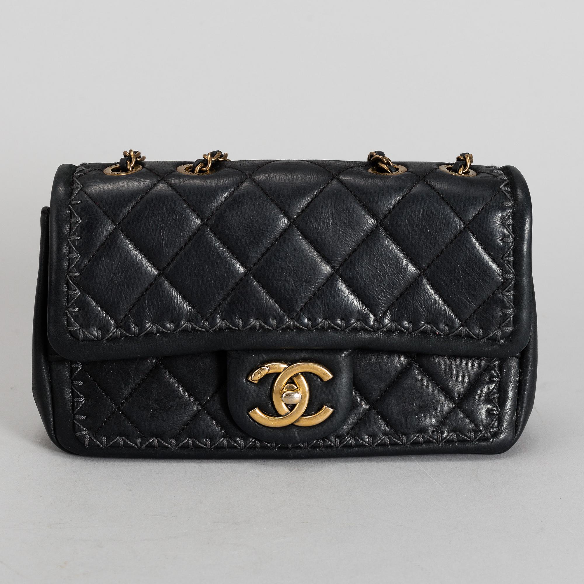 CHANEL a black quilted fabric Flap Bag 2015 2016. Bukowskis