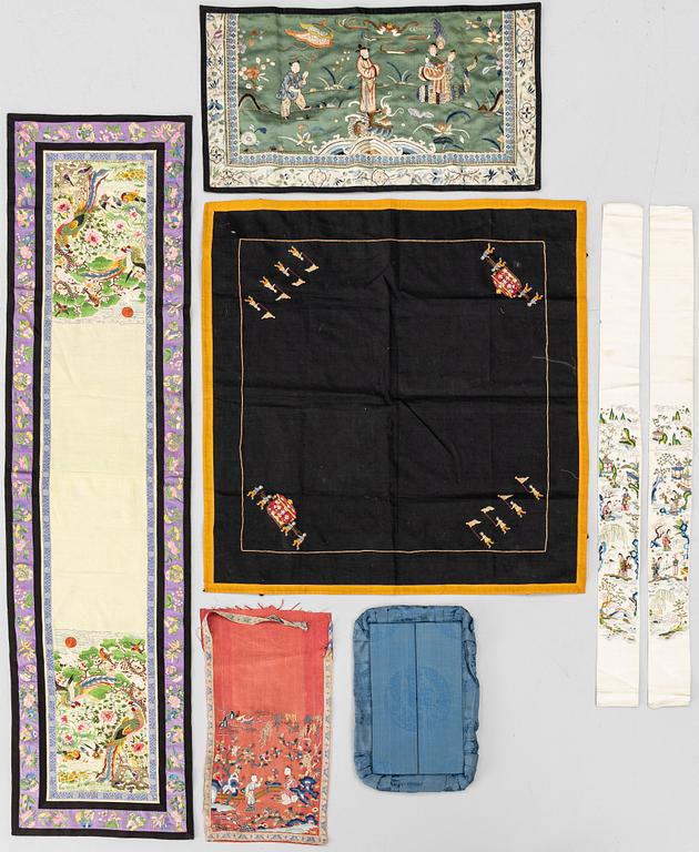 A group lot of embroidered silk textiles and a silk sowing purse, late Qing dynasty/early 20th century.