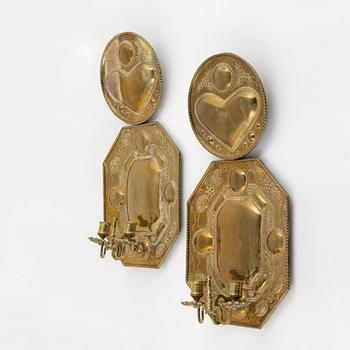 A pair of baroque style brass sconces, around 1900.
