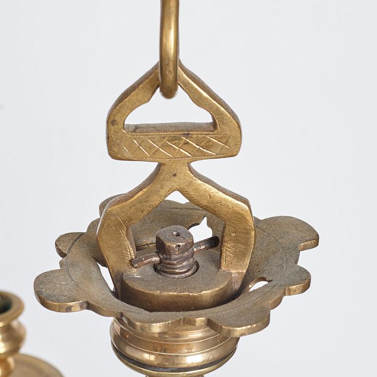 A six-light 18/19th century brass chandelier.