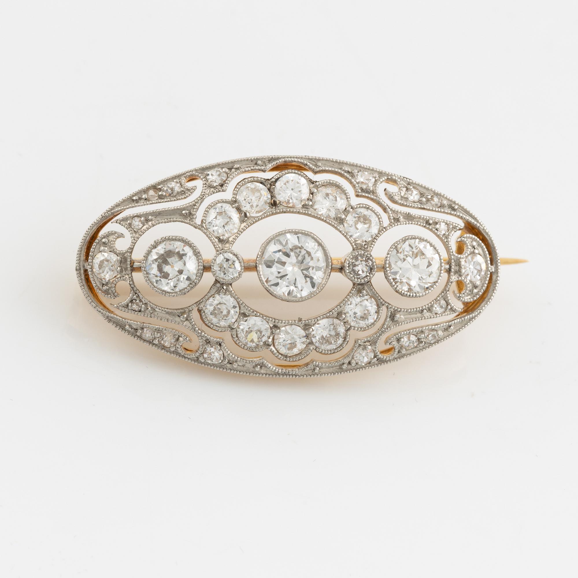 Gold and platinum and old cut diamond brooch.