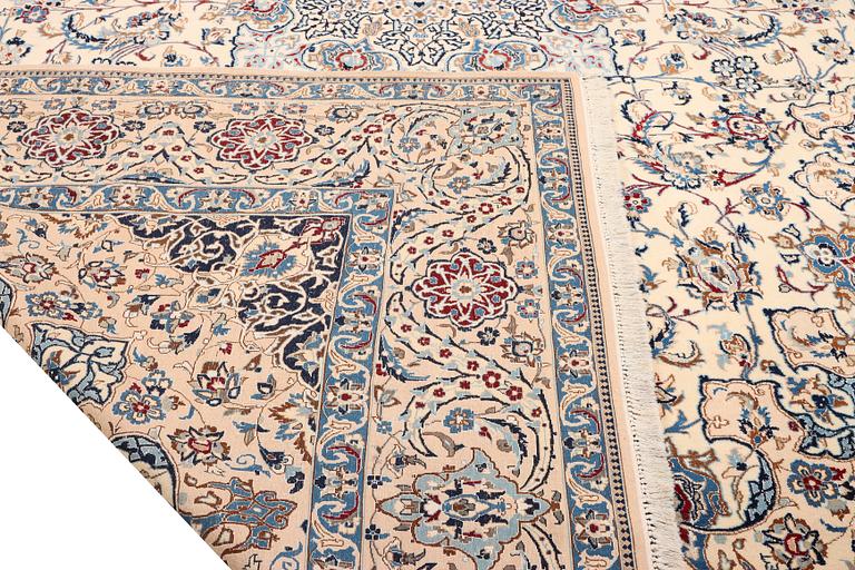 A Nain, part silk carpet, c. 474 x 322 cm.