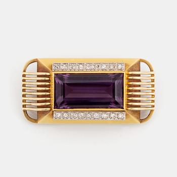 426. A 14K gold brooch set with a faceted amethyst and eight-cut diamonds.