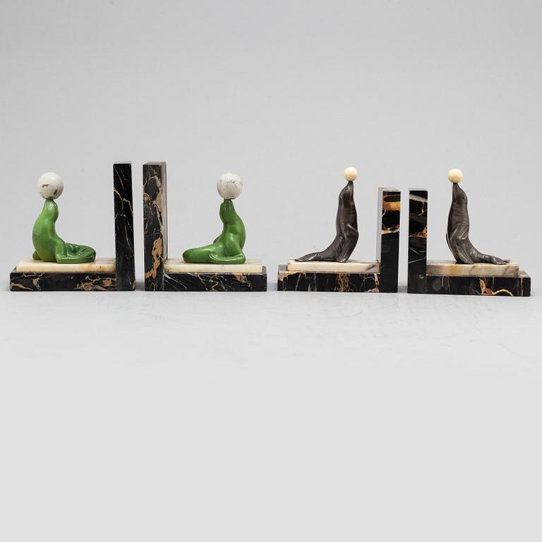 Two pairs of 20th century Art Deco bookstands decorated with sealions.