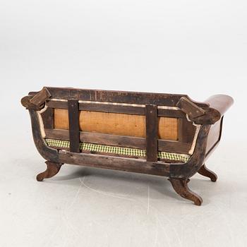 A mid 1800s late Empire mahogany sofa.