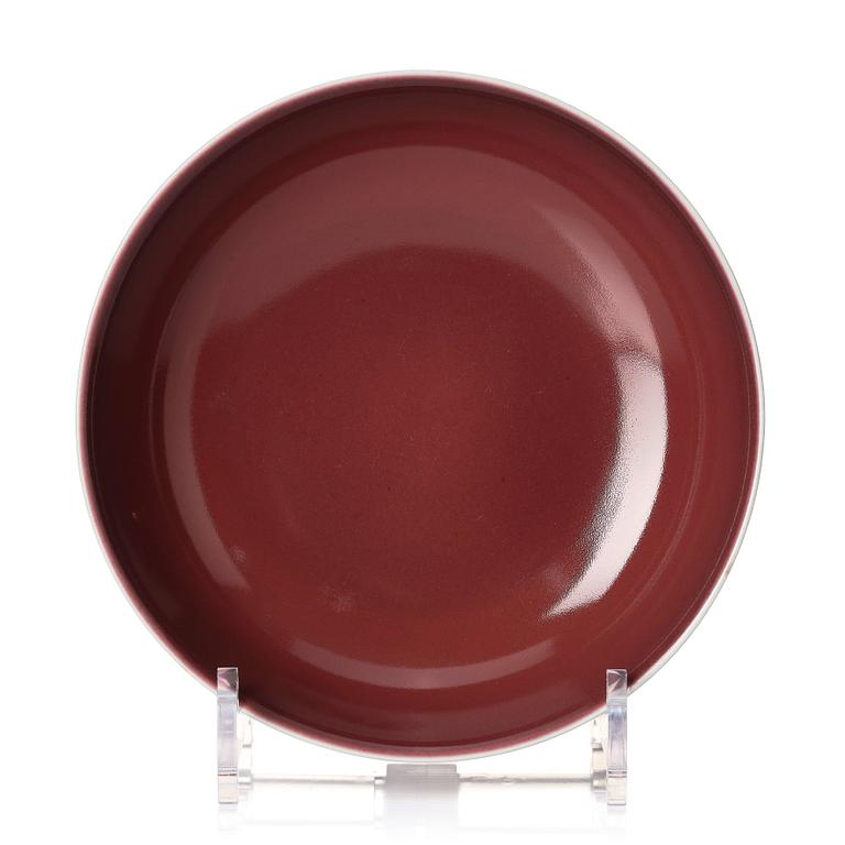 A copper-red glazed dish, Qing dynasty with Qianlong mark and of the period (1736-95).