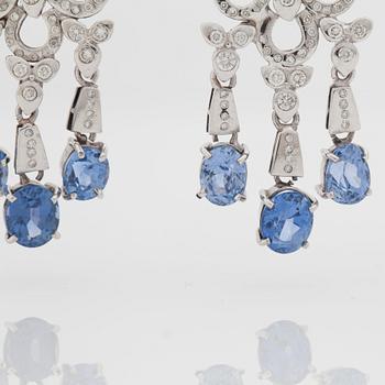 A pair of sapphire and brilliant cut diamond earrings. Mandelstam 'Stardust Shuttle'.