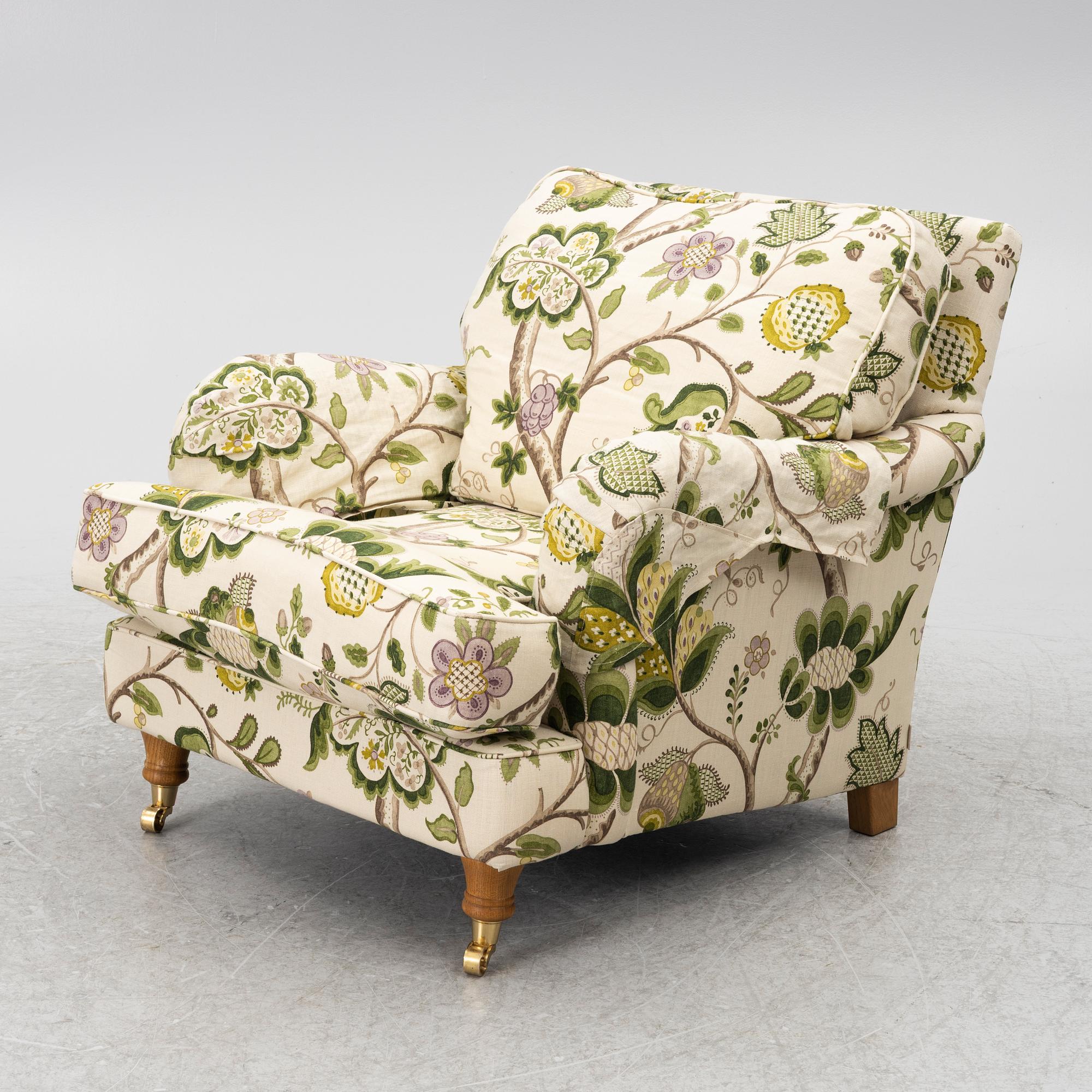 A 'Howard' armchair with footstool, Englesson.