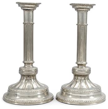 952. A pair of pewter candlesticks by S. Weigang 1785.