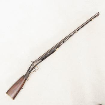 A double barreled percussion gun, 19th century.