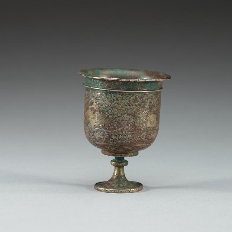 A silver stem cup with hunting scenes, presumably Tang dynasty.