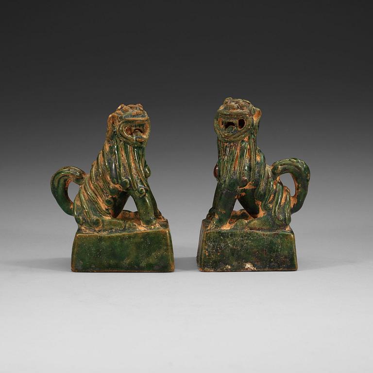 A pair of green glazed joss stick holders, Ming dynasty (1368-1644).