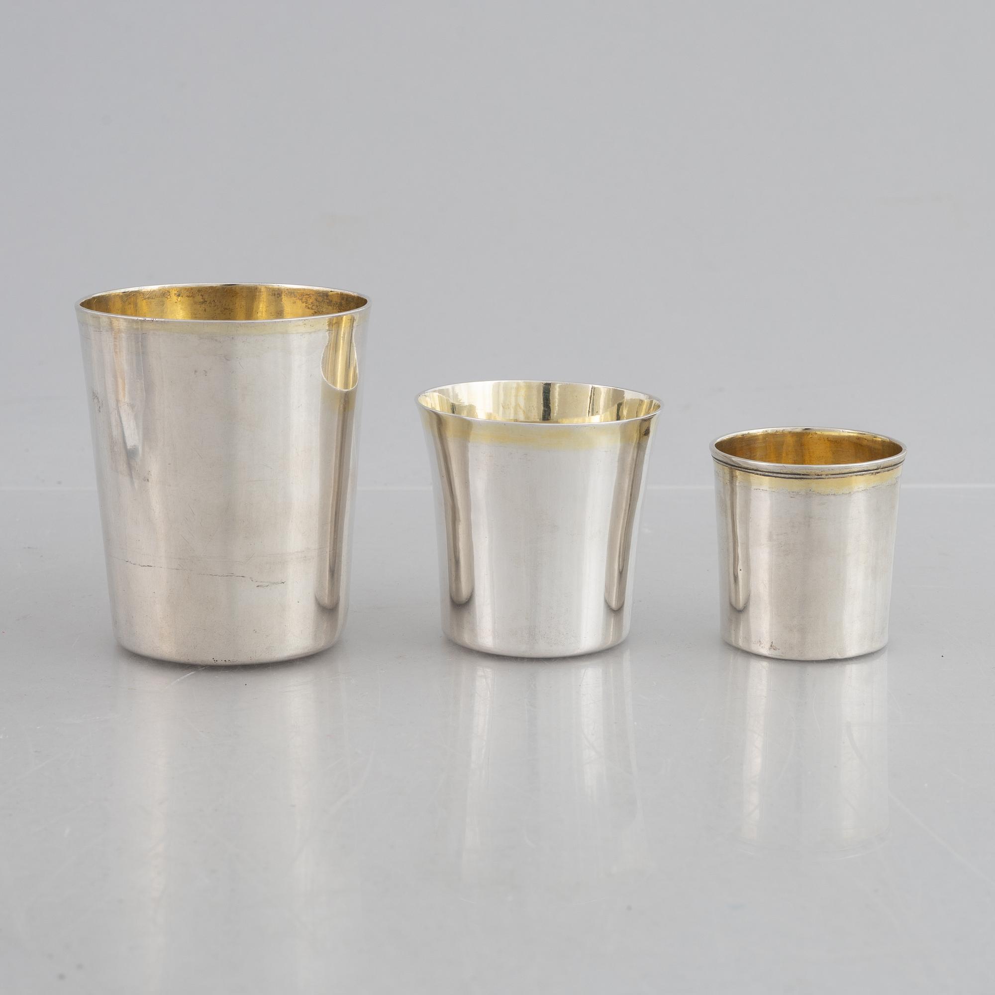 Three Swedish parcel-gilt silver beakers, 19th Century.