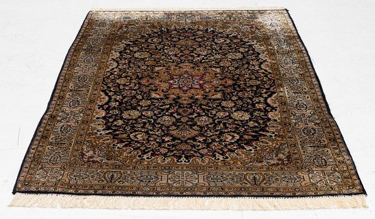 A Ghom, silk rug, c. 162 x 102 cm.
