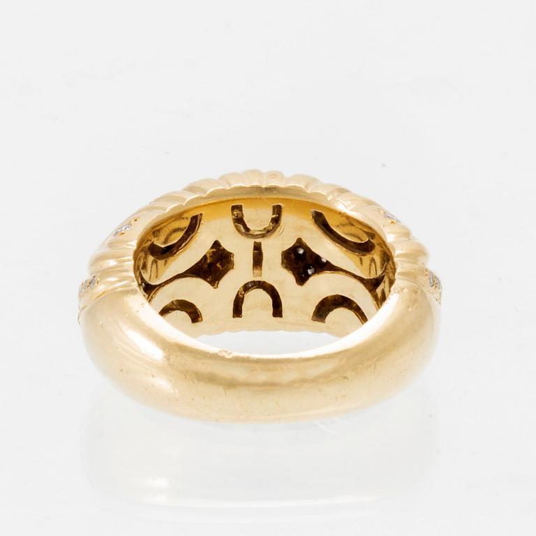 An 18K gold ring set with round brilliant-cut diamonds, London.