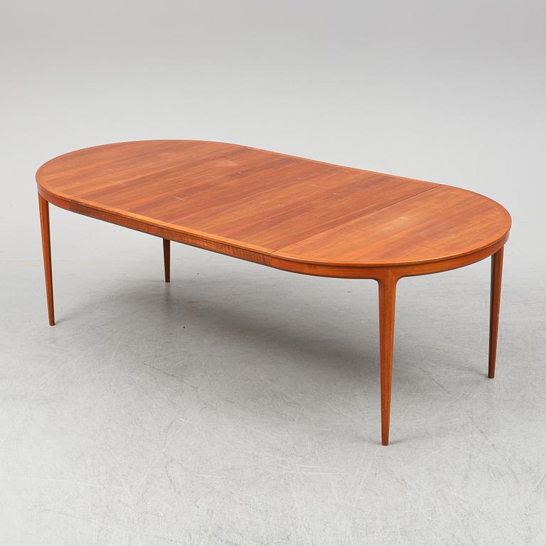 BERTIL FRIDHAGEN, a seven  piece walnut dining suite from Bodafors.