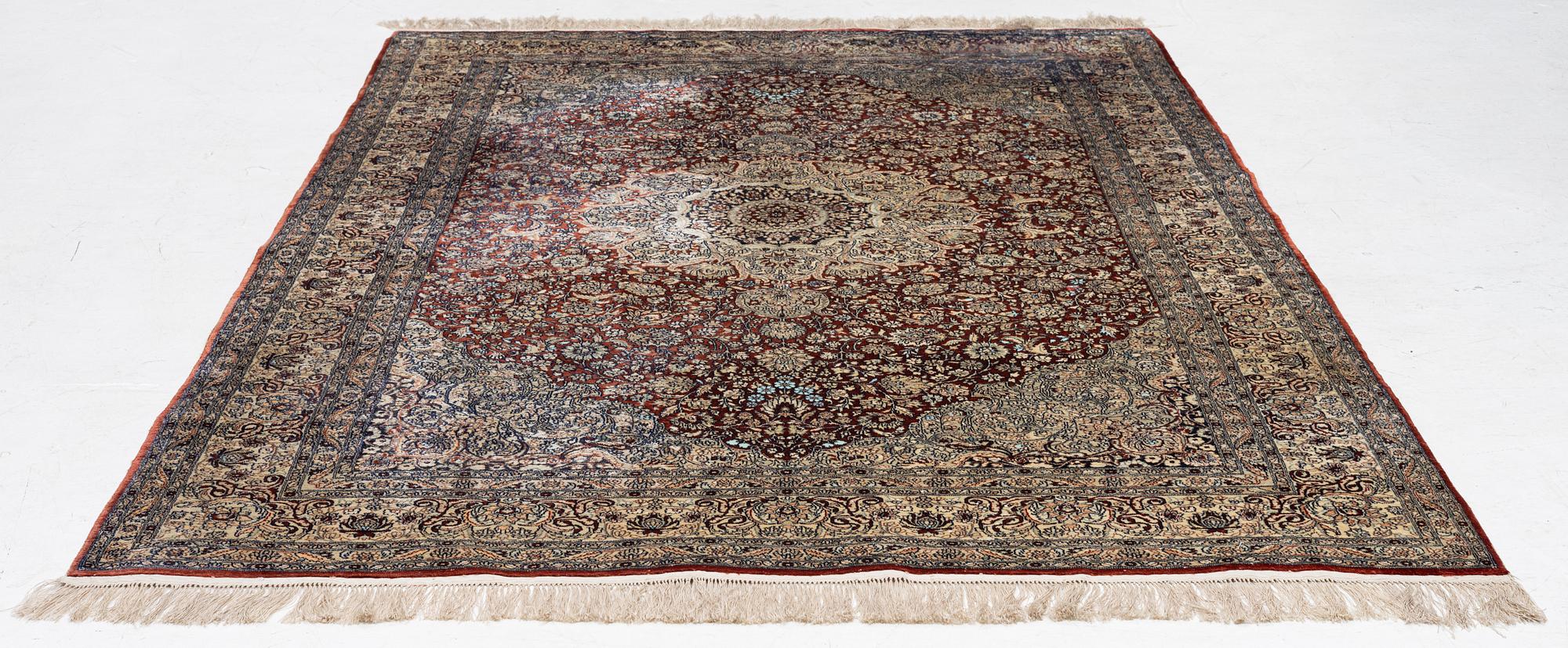 Carpet, part silk, approx. 240 x 158 cm.
