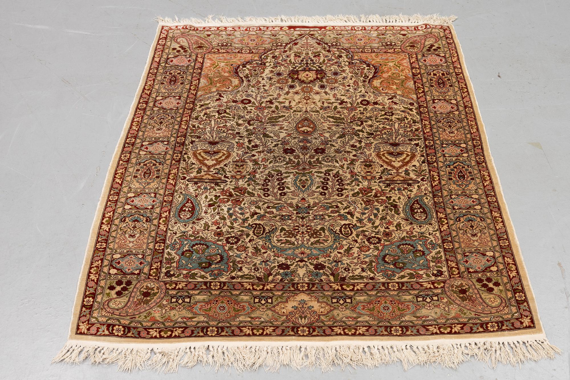 A rug, Old silk Hereke, ca 152 x 110 cm.