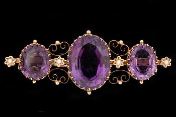 A Victorian amethyst and pearl brooch.