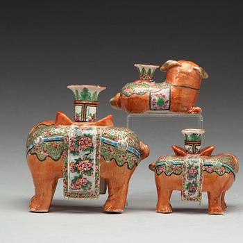 A group of Canton famille rose candle sticks, late Qing dynasty, early 20th Century.