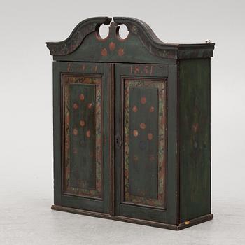 A wall-hanged cabinet, Sweden, dated 1851.