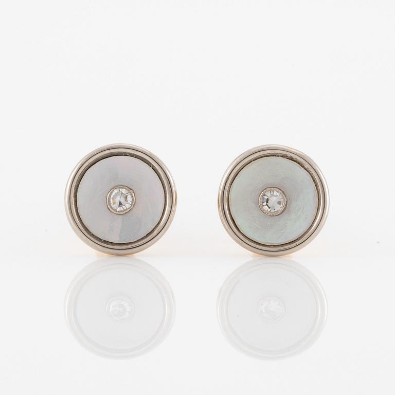 C.G Hallberg, cufflinks and shirt studs, two pairs, 18K gold with diamonds and mother-of-pearl.