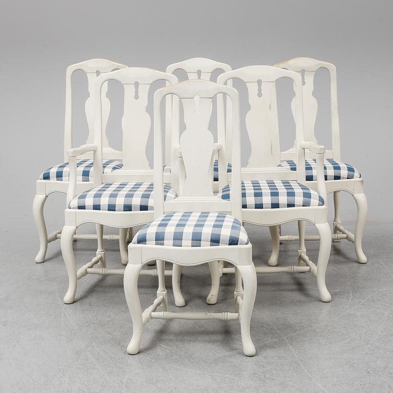 A rococo style dining table with 4+2 chairs.