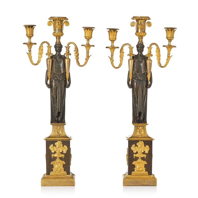 A pair of French Empire ormolu three-branch candelabra, Paris, early 19th century.