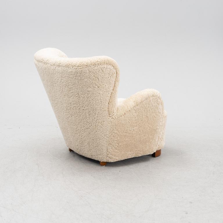 A lounge chair with new sheepskin upholstery, Denmark, 1940's.