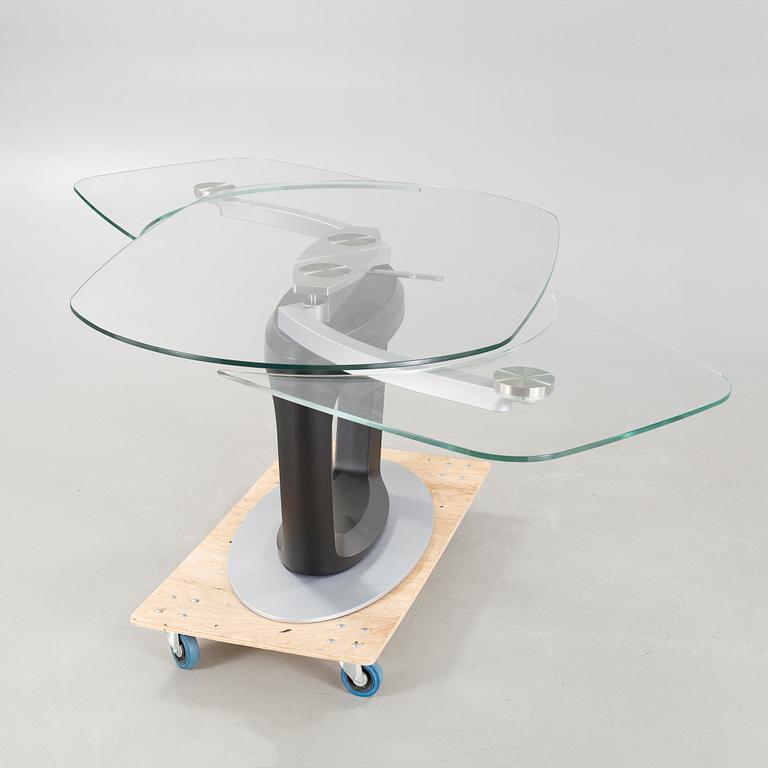 A 21st century "Orbital" dinner table by Pininfarina for Calligaris.