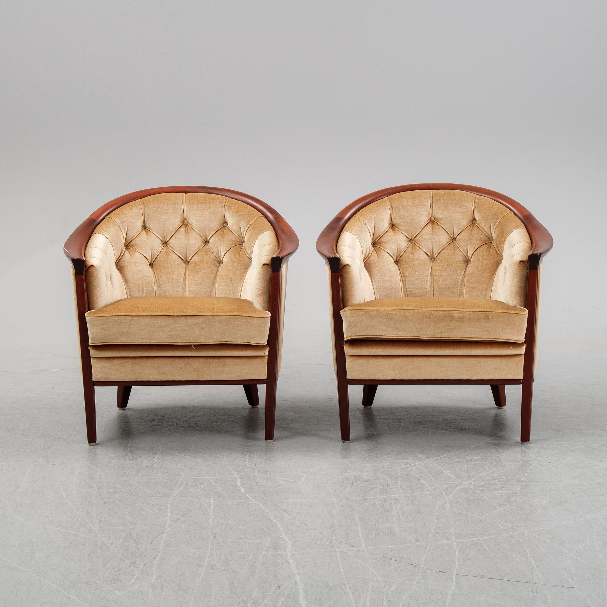 A pair of mahogany and velvet easy chairs by Bröderna Andersson, 1960's.