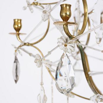 A seven-light gilt brass and cut glass rococo chandelier, mid 18th century.