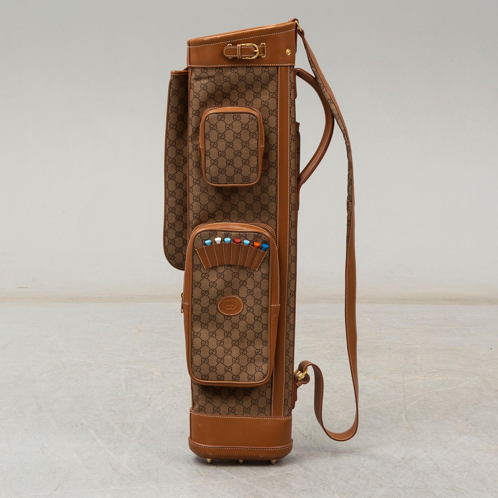 GUCCI a monogramcanvas and leather gold bag. Bukowskis