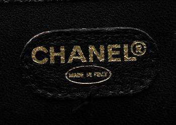 A 21th cent black "caviar" leather beautybox/weekendbag by Chanel.