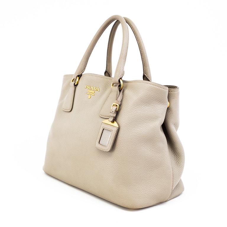 A tote/crossbody handbag by Prada.