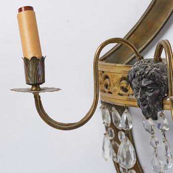 A pair of Russian Louis XVI-style  four-branch gilt bronze appliques, 19th century.
