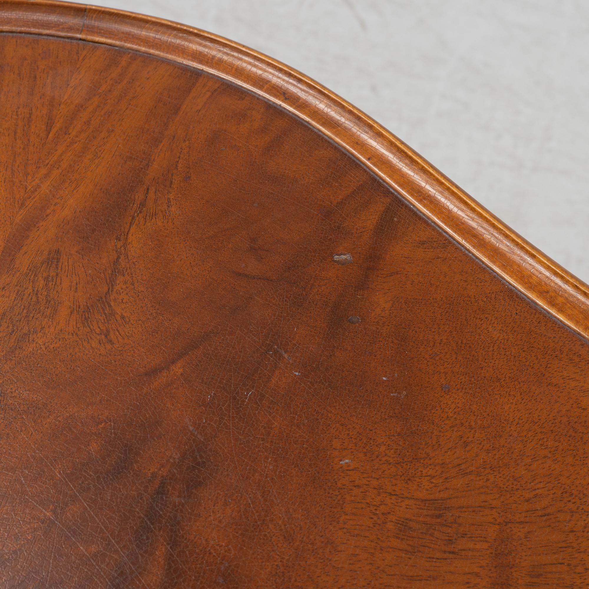 A 1940s mahogany coffee table.
