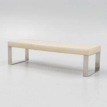 A contemporary leather upholstered bench,