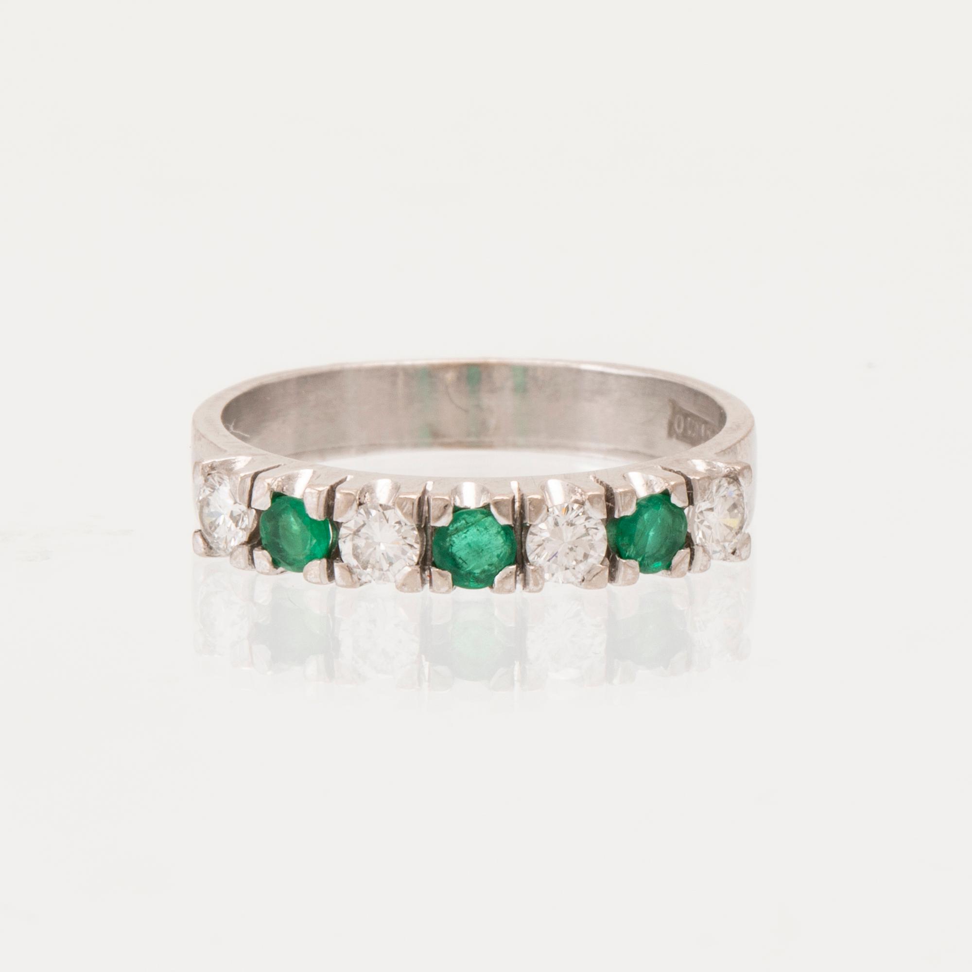 Ring half-eternity 18K white gold with round faceted emeralds and diamonds, Heribert Engelbert Stockholm 1981.