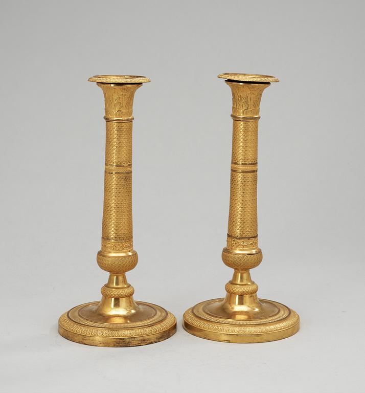 A pair of Empire candlesticks, 19th Century.