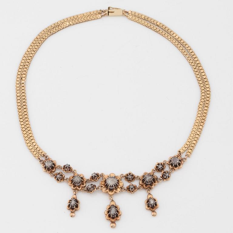 A necklace set with rose-cut diamonds.