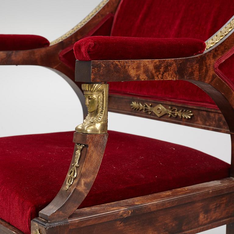 A pair of Empire style armchairs, first half of the 20th century.