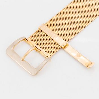 An 18K gold bracelet.
