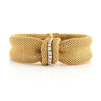 An 18K gold Bucherer bracelet set with round brilliant-cut diamonds.