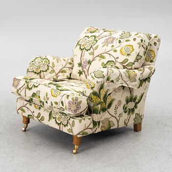 A 'Howard' armchair with footstool, Englesson.