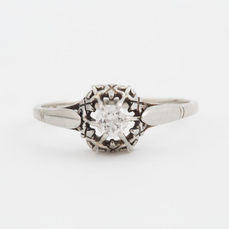 A ring set with a transitional-cut diamond.