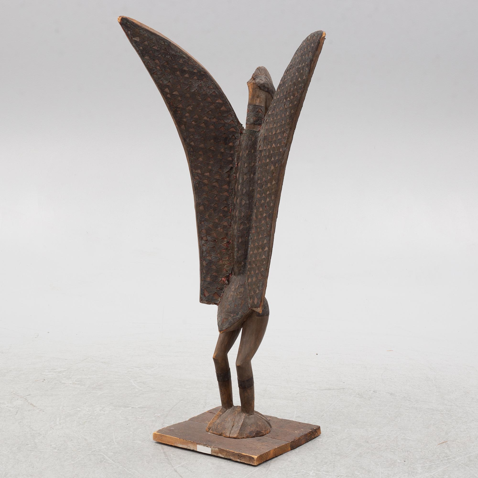 A sculpture, likely Ivory Coast, 20th century.